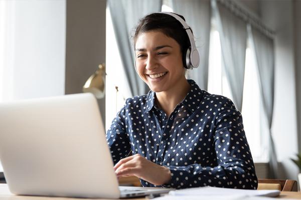 Indian woman using laptop for online classes